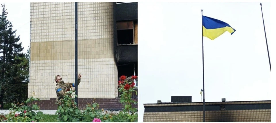 Українській воїн підіймає прапор України у звільненому Ізюмі, Харківська область, 2022 рік. Фото: со